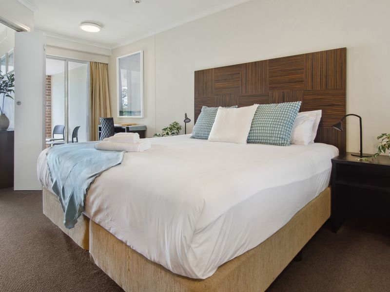 Comfortable bedroom with plush bedding