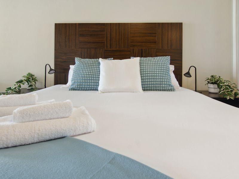 Comfortable bedroom with plush bedding