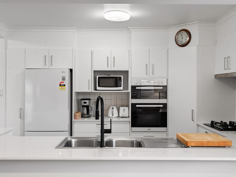 Spotlessly clean and well-organized, this kitchen is ready for you to cook and enjoy your favorite meals.