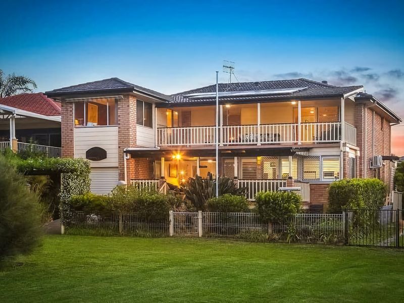 A stunning exterior with lush landscaping, offering a warm welcome to your getaway.