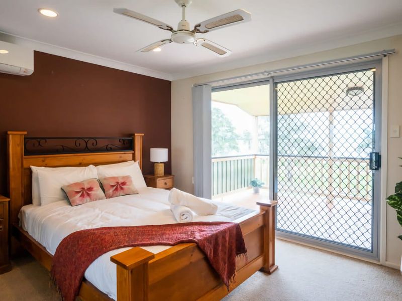 Bedroom 1 - Relax in this cozy and stylish bedroom, perfect for a restful night's sleep.