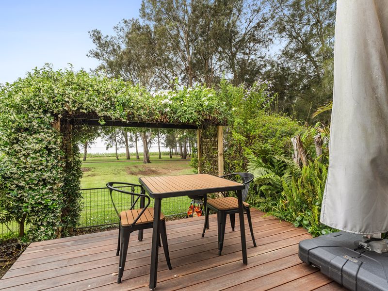 Enjoy peaceful lake views from your private studio’s outdoor seating area.