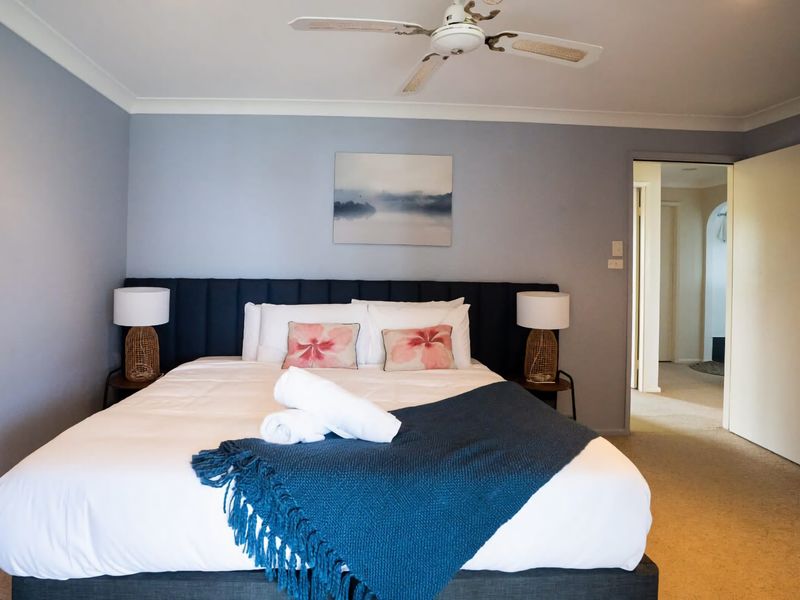 Bedroom 3 - Bright and airy bedroom with lake views for a peaceful retreat.