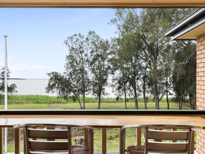 Relax outdoors with comfortable seating and uninterrupted views of the lake.