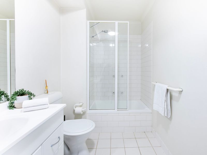 Spacious bathroom with glass-screen shower