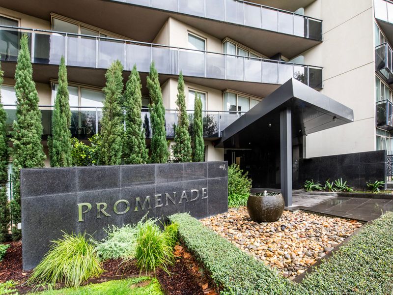 Stylish building entrance with landscaped surrounds