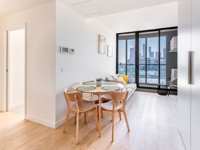 Dining area with seating for four and plenty of natural light.