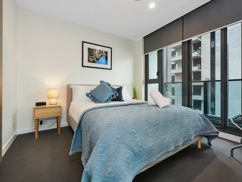 Second bedroom with queen bed and built-in wardrobe