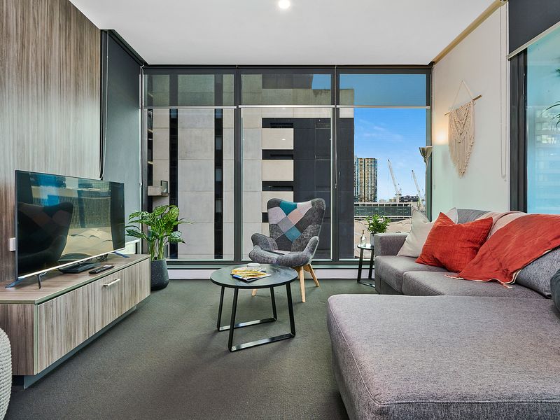 Spacious living area with smart TV and natural light