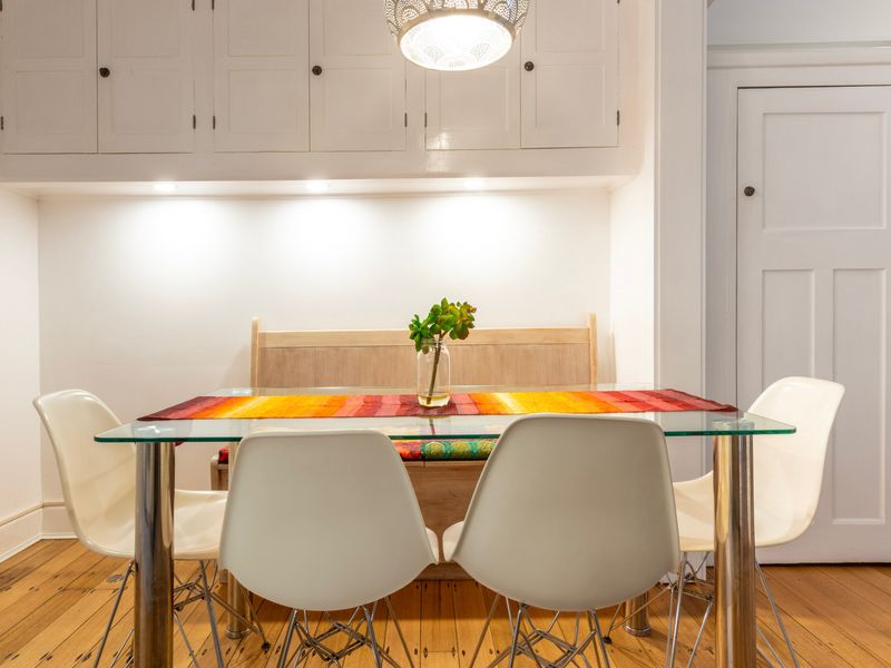 Dedicated dining area with clean lines and a pop of colour for relaxed meals