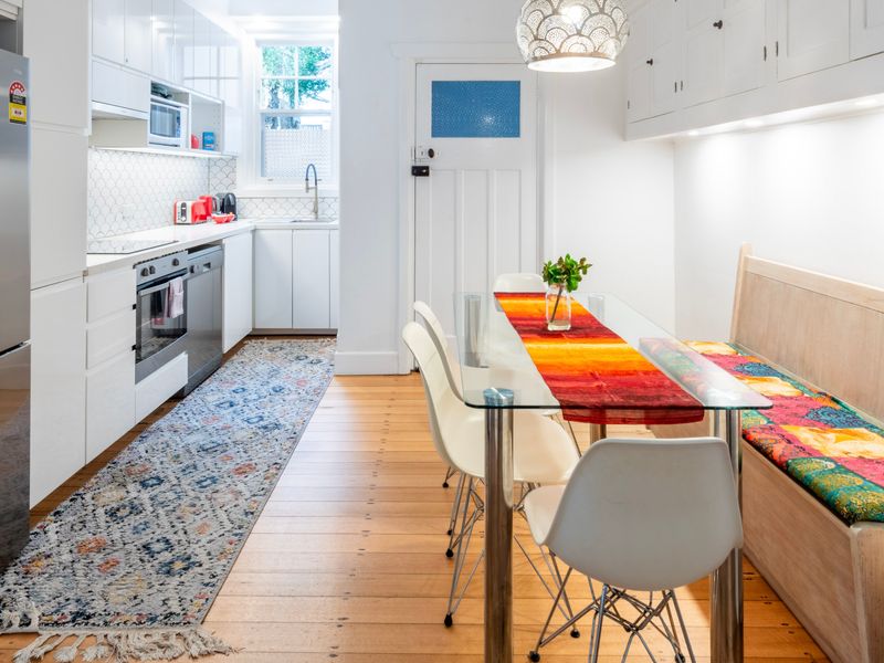 Bright kitchen and dining nook with colourful accents and casual seating