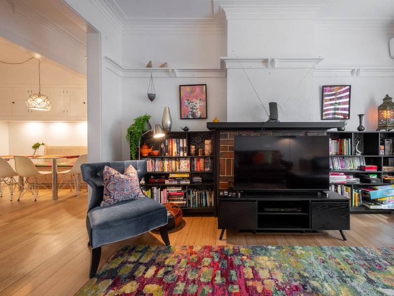 Inviting lounge space with eclectic styling, artwork and a cosy, homely feel