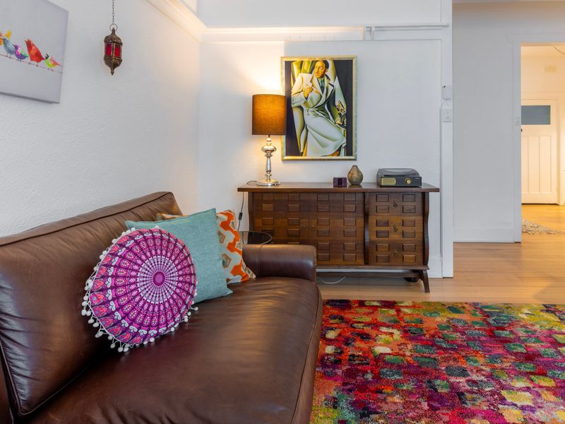 Relaxed sitting space with layered textures and warm decorative touches