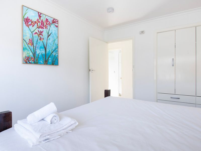 Bedroom with fresh linens and towels