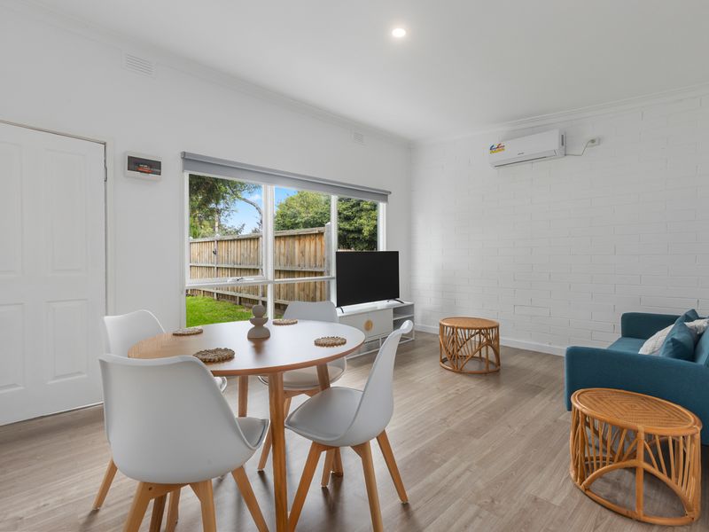 Bright open living and dining area with garden outlook