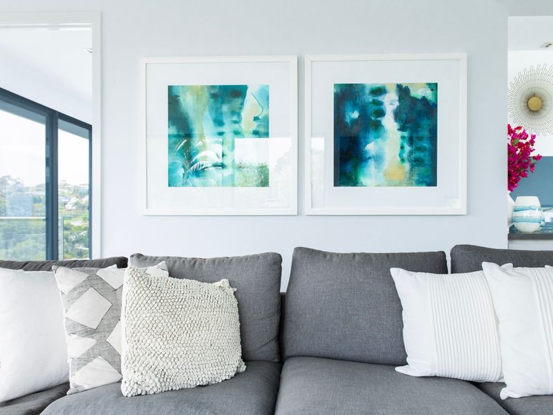 Stylish lounge with plush seating and contemporary artwork