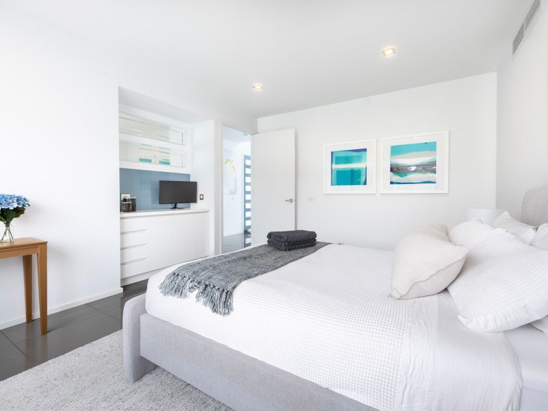 Minimalist bedroom with generous space and natural light