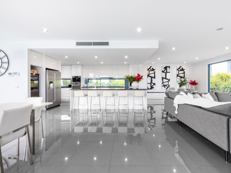 Elegant open-plan kitchen and dining for family meals.