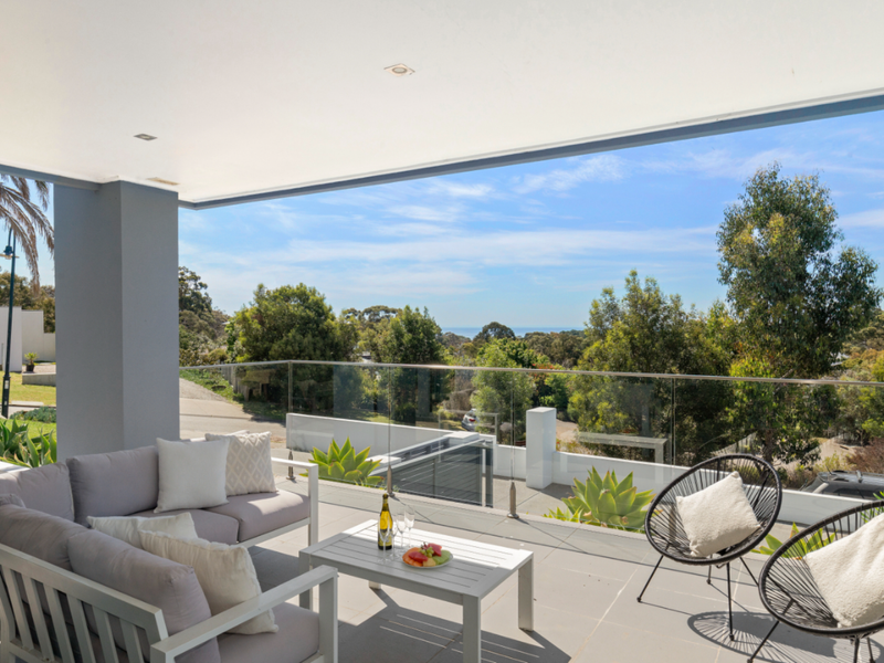 Relax on the balcony and soak in serene green views.