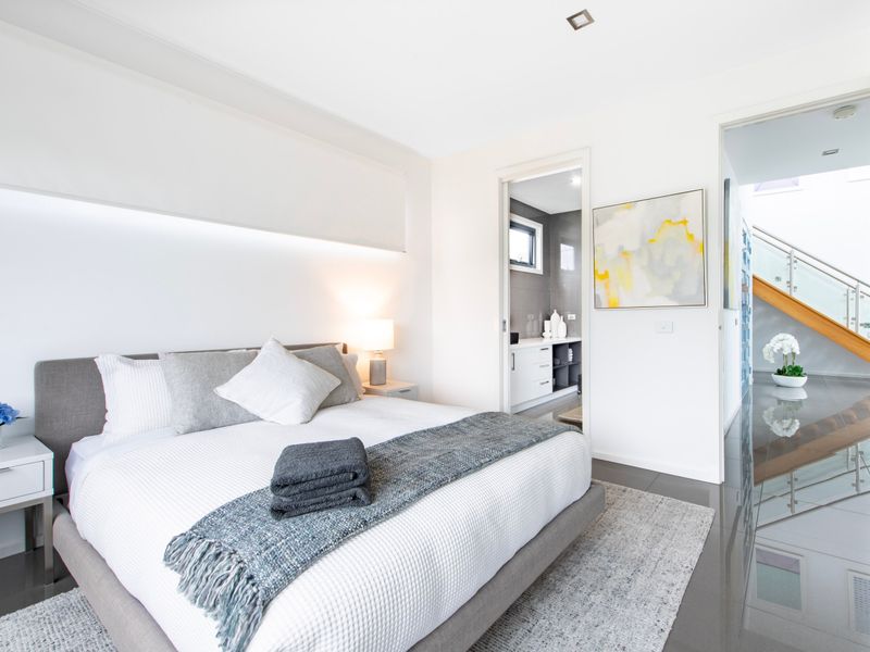 Cozy bedroom with plush bedding and thoughtful styling