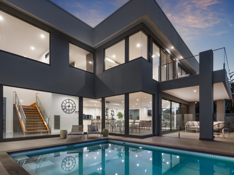 Modern exterior with a sparkling pool and sleek architecture.