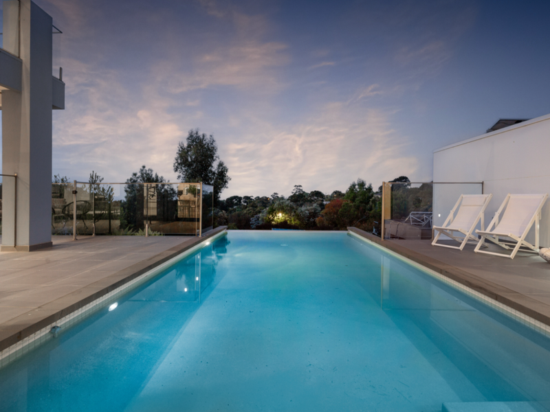 Take a dip in the inviting outdoor pool under the sun.