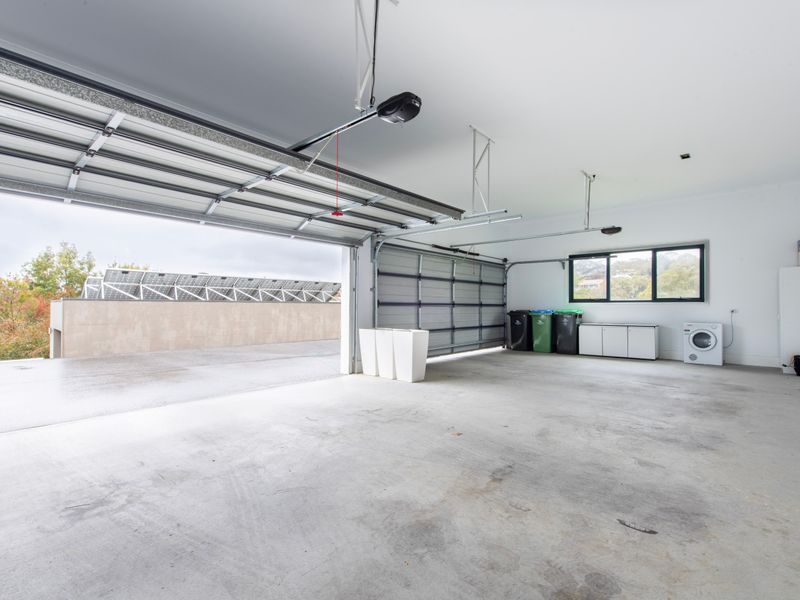 Secure garage with ample space for parking and storage