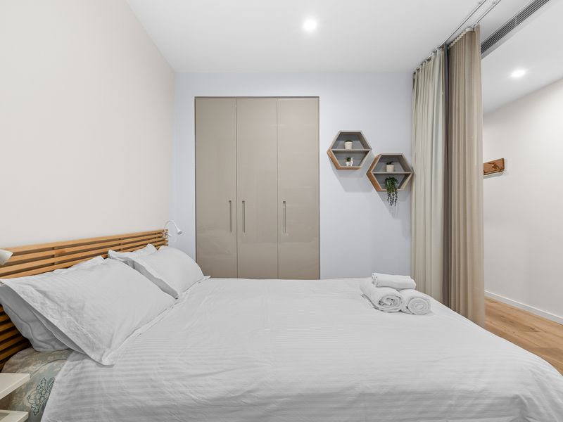 Sleep in comfort: Queen bed with fresh linens and pillows, plus a convenient closet for your things.