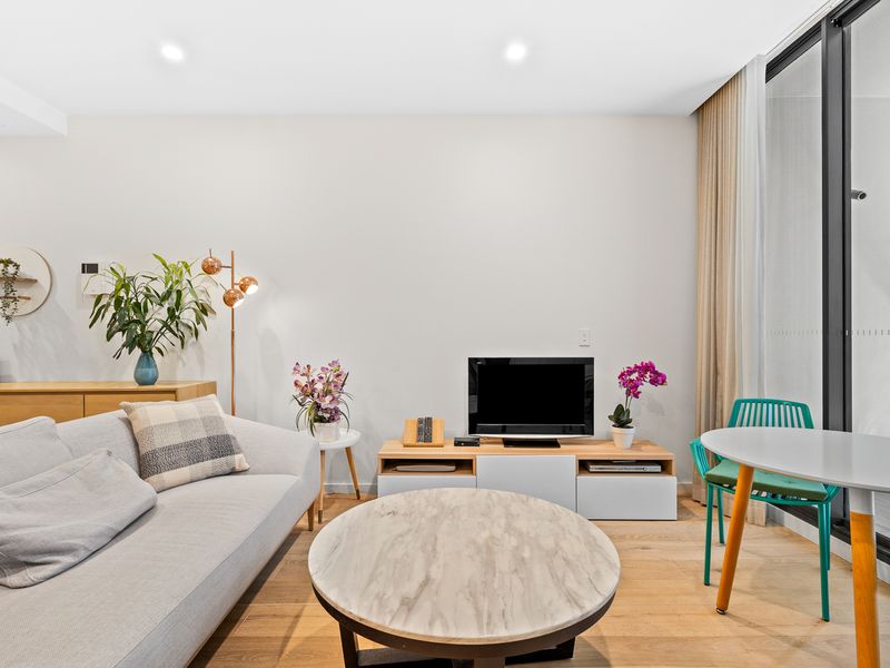 Open and airy living: Enjoy seamless indoor-outdoor living with balcony views and a comfy space to unwind.