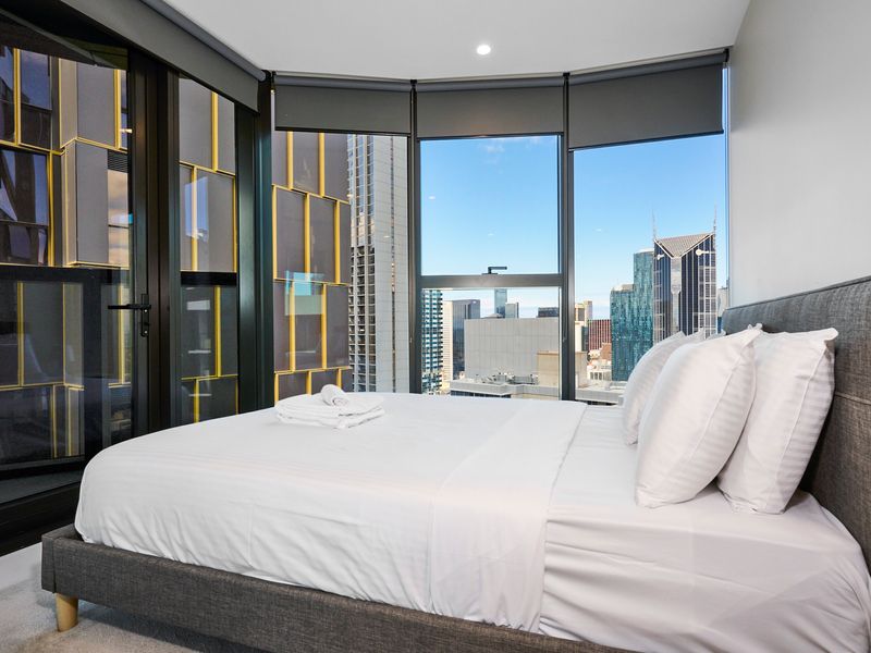 Bedroom with curved windows and panoramic views