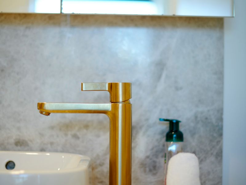 Close up of gold fixtures adding a touch of luxury