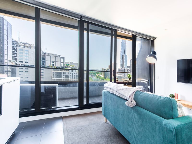 Sunlit lounge overlooking the city skyline