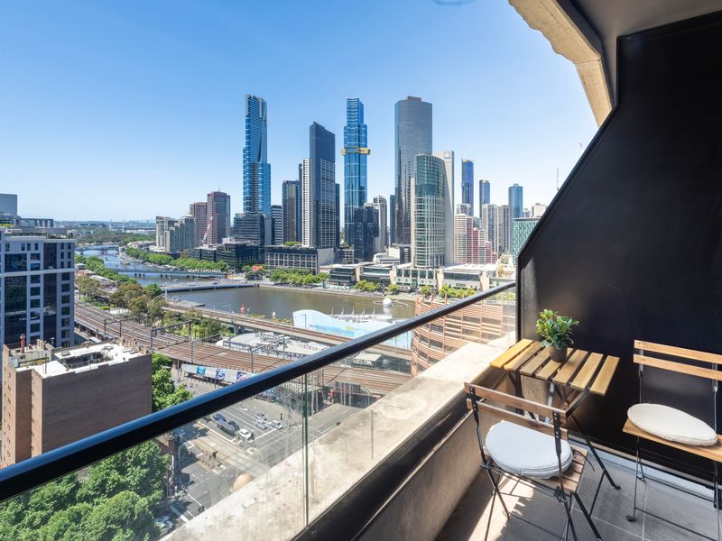 Private balcony with outdoor seating and panoramic Melbourne views