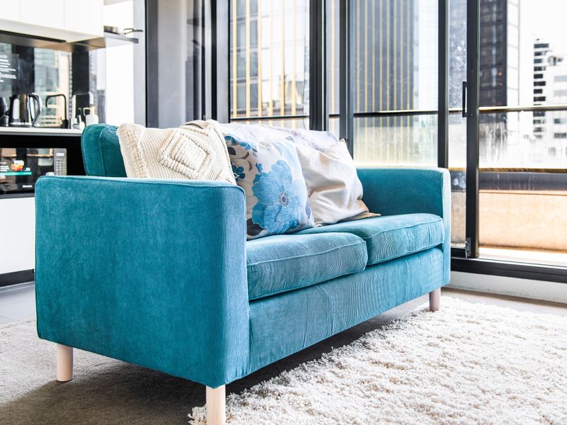 Cozy sofa with natural light and city outlook