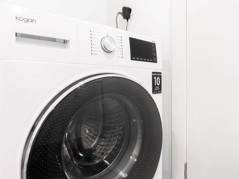 Convenient laundry area with a washer, making your stay hassle-free.