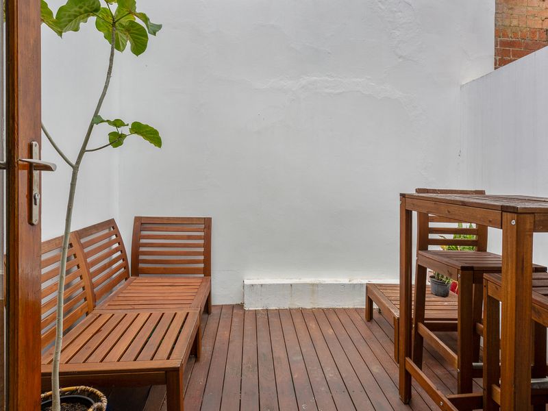 Perfect spot for outdoor meals and unwinding with comfortable seating.