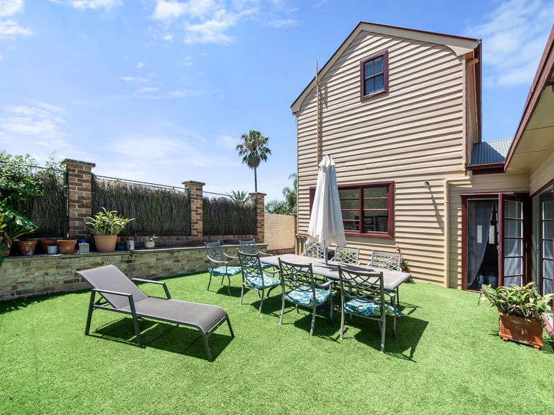Relax in style with this sunny outdoor patio and dining area.