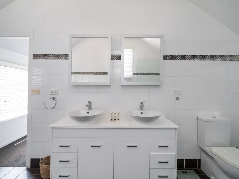 Double vanity and rain shower, perfect for a relaxing stay.