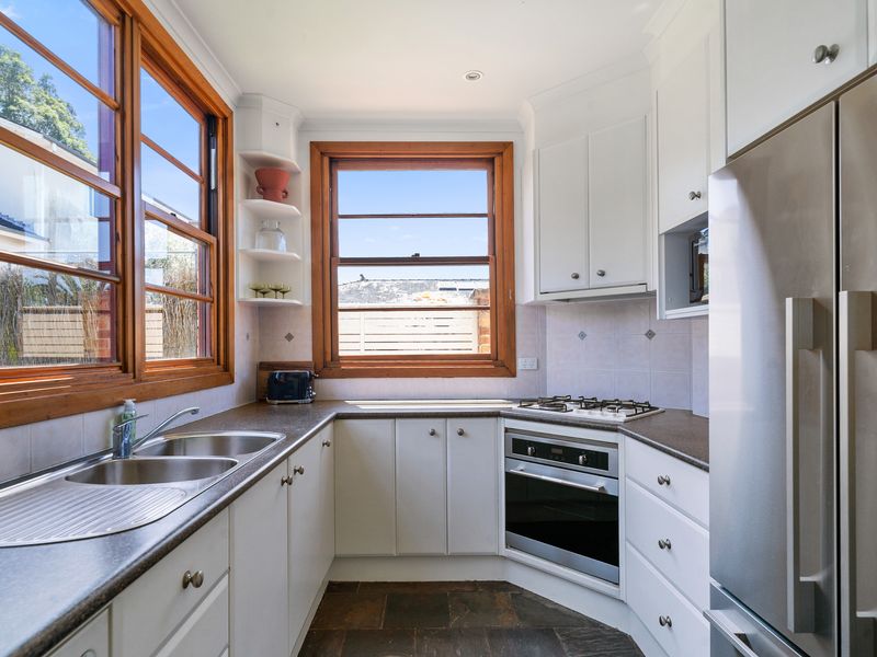 Fully equipped kitchen featuring modern appliances and a spacious layout.