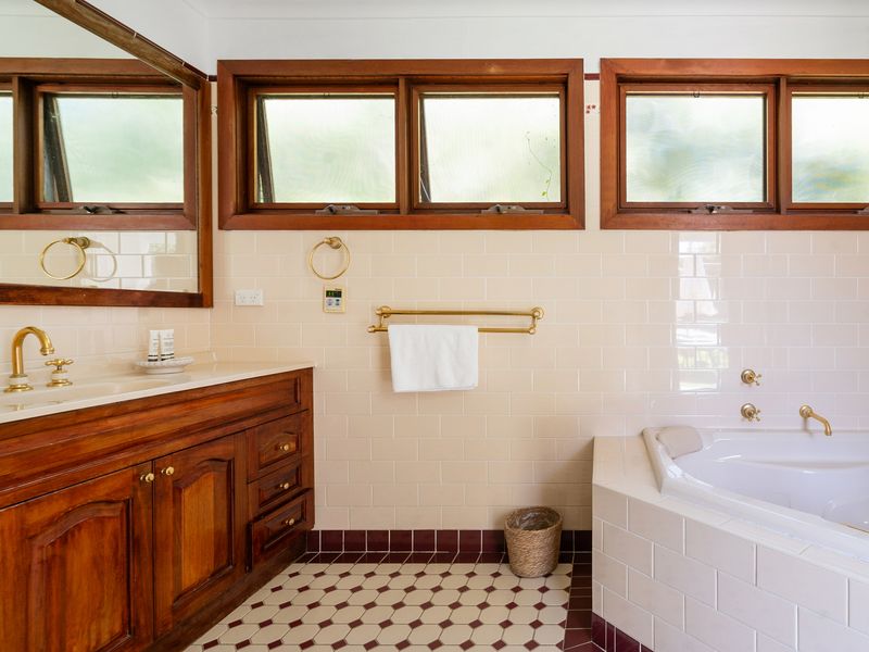 Spacious bathroom with a luxurious spa bath for ultimate relaxation.