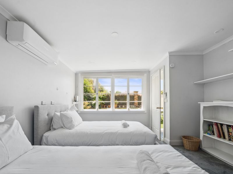 Enjoy restful nights in this light-filled twin bedroom.