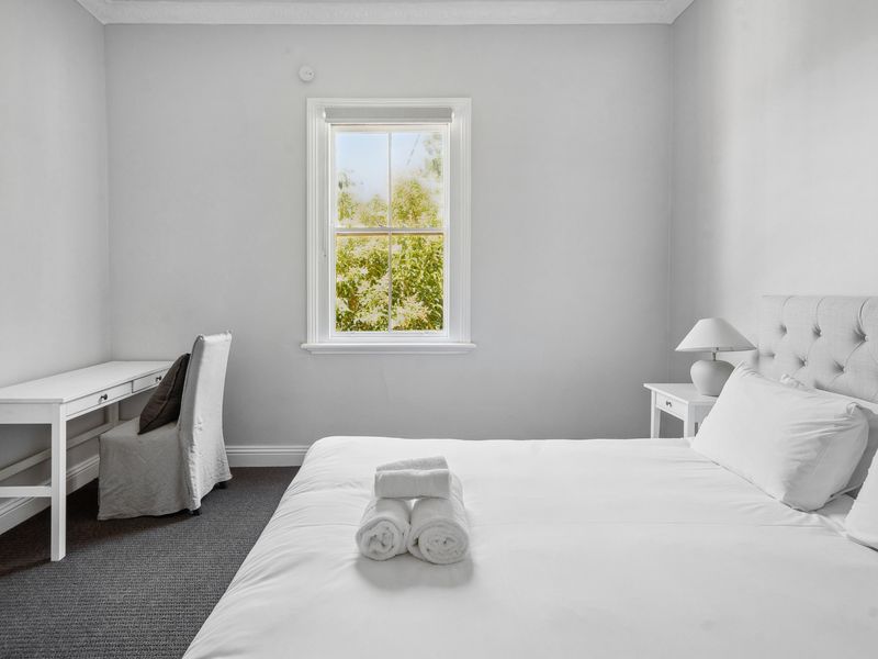 Perfect blend of comfort and functionality with a desk for remote work.