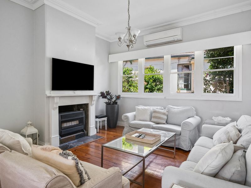 Enjoy movie nights on the large screen in this elegant living space.