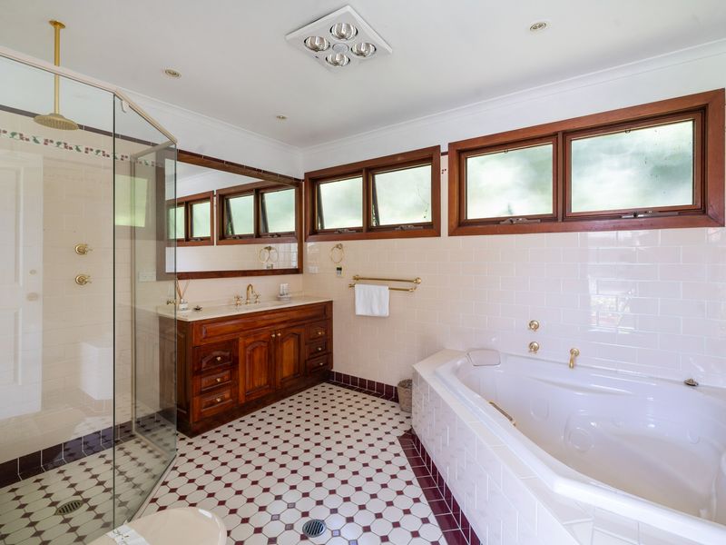 Bright and airy bathroom featuring vintage charm and modern comforts.