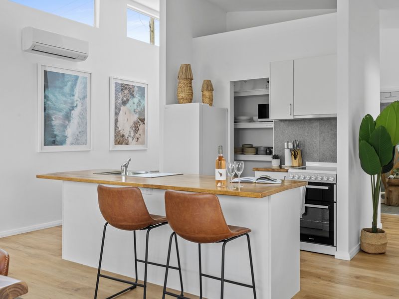 Cook up a storm in this sleek, modern kitchen with top-of-the-line appliances and all the essentials for a culinary masterpiece.