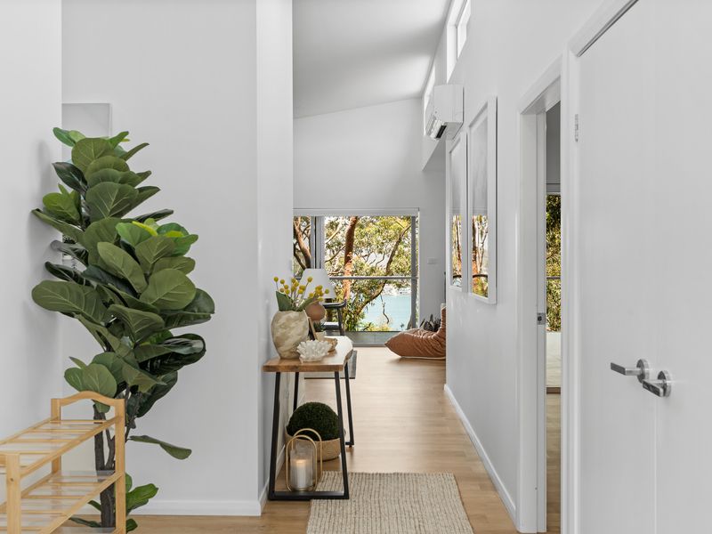 Step into a light-filled hallway that leads you effortlessly to each beautifully designed space, setting the tone for your stay.