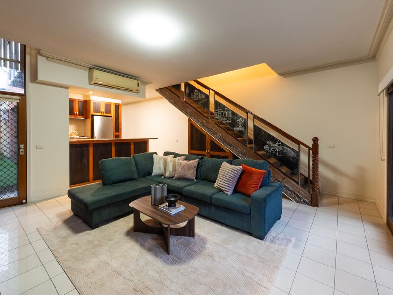 Architectural Flow: Impressive open floor plan highlighting a statement timber staircase and integrated layout.