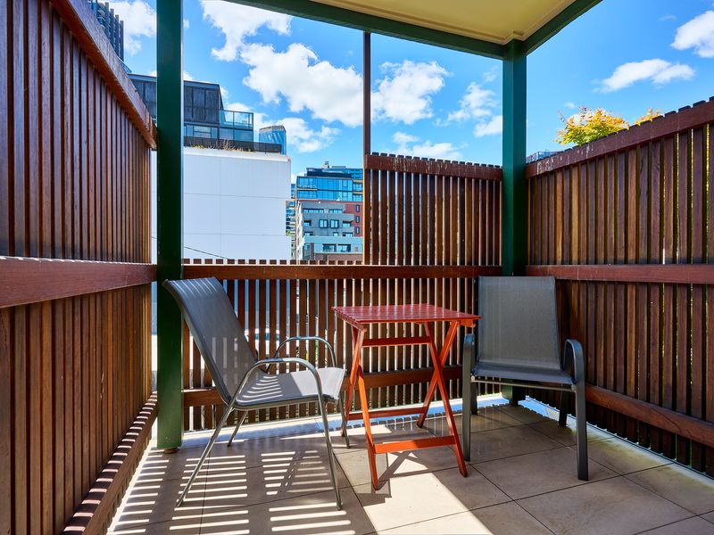 Private Balcony: A secluded, timber-screened outdoor nook perfect for catching the morning breeze.