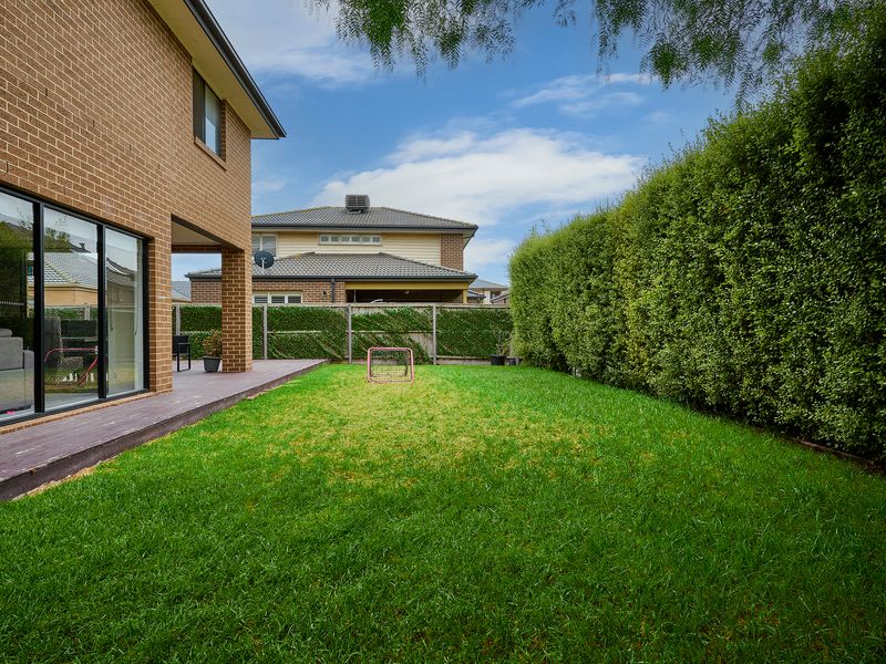 The property features a spacious backyard, perfect for outdoor activities and relaxation.