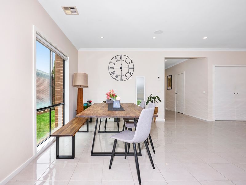 The property offers an open layout dining area, seamlessly connected to the living space for a modern and airy feel